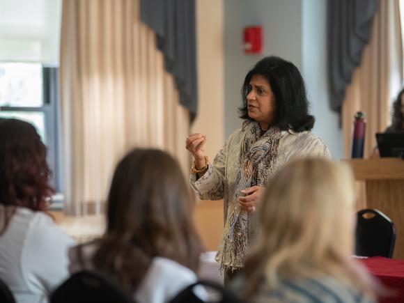 Dr. Shoba Rajgopal speaking to students at a film screening event