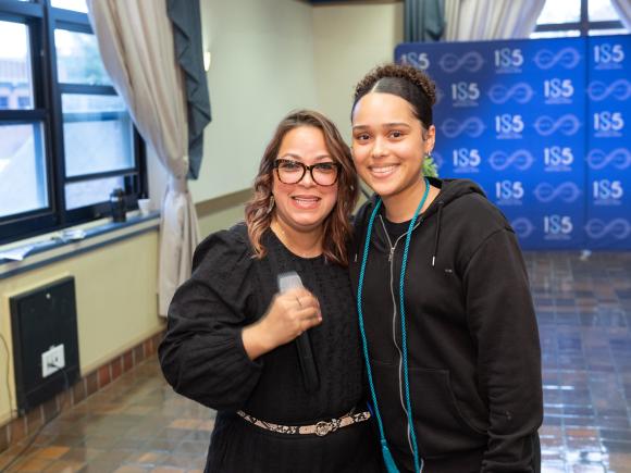 Staff member and student at the FACES annual Scholarship Dinner.