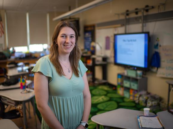 Education student smiling at her student teaching position.