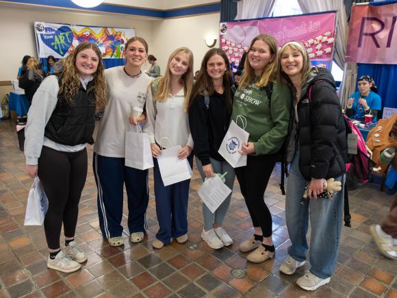 Students smiling in a group at Fresh Check Day.