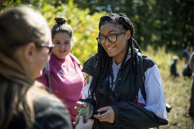 Students in the Restorative Ecology class work in the field.