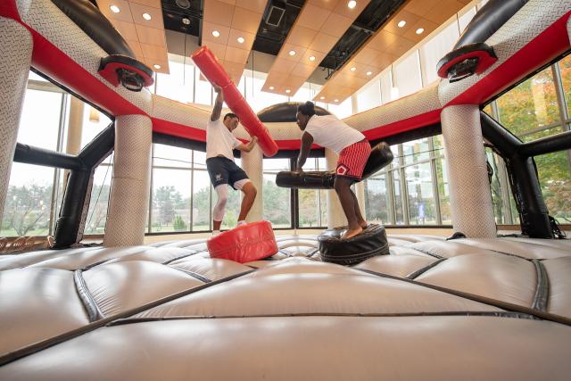 Two students playing a game during Family Weekend.